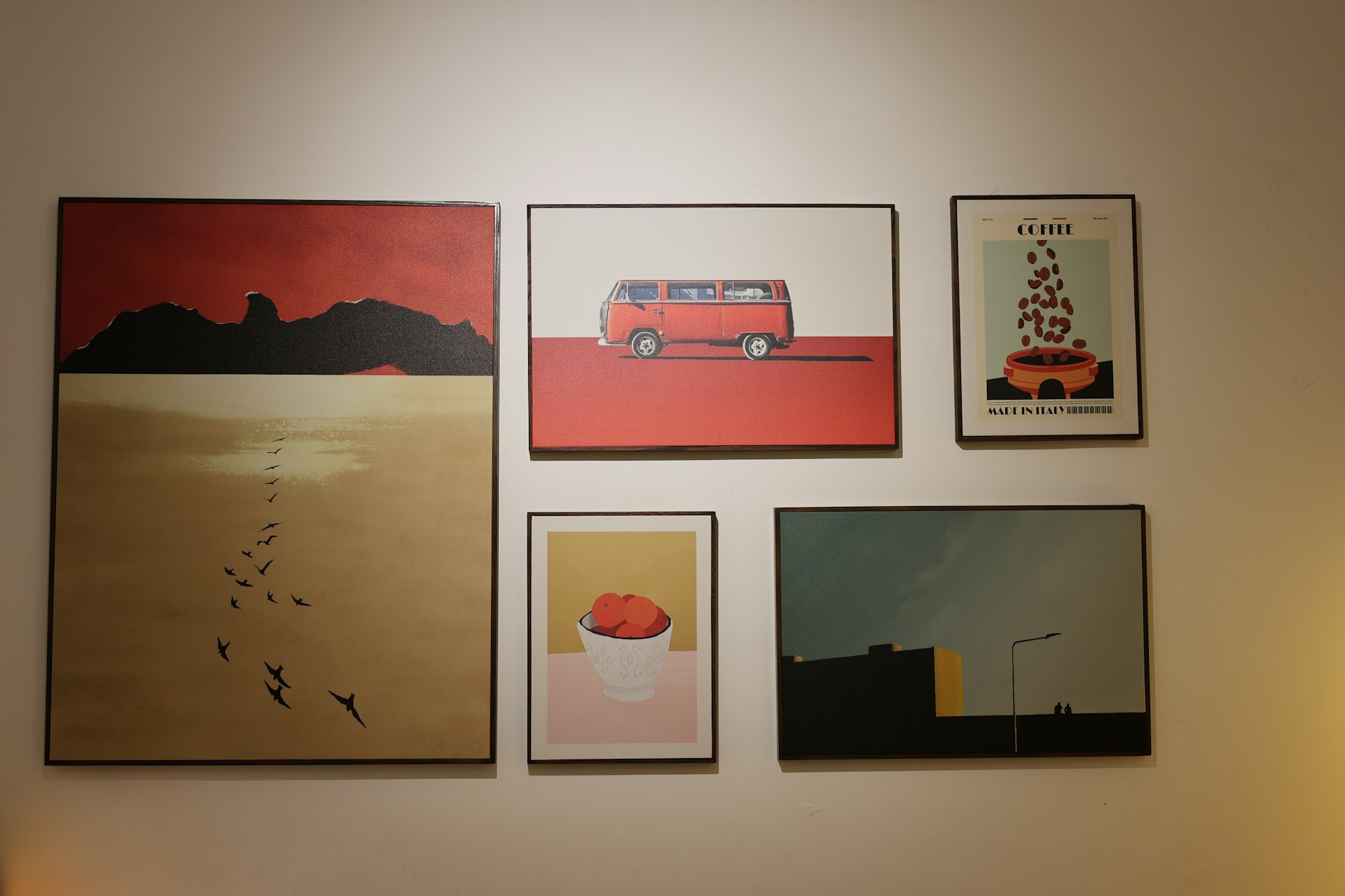 Art prints arranged creatively on a wall.